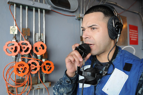 USS Ronald Reagan Sailor communicates info during exercise.