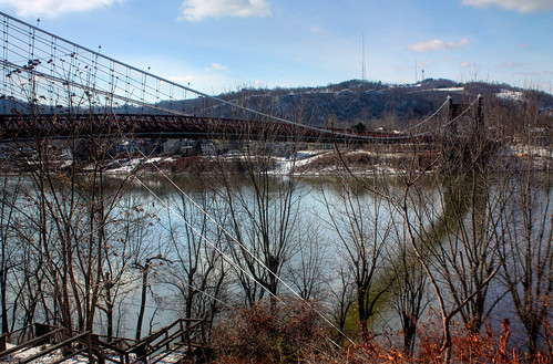 The Wheeling Suspension Bridge is a suspension bridge spanning the main channel of the Ohio River at Wheeling, West Virginia. It was the largest suspension