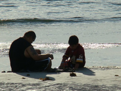 quotes about children growing up. A Growing Up Boy and The Beach. On a half-kneeling position,