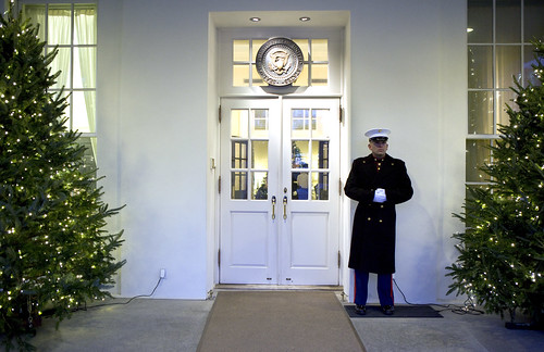 A Marine Sentry stands guard outside the West Wing entrance of the White House