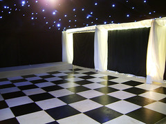Dance floor hidden behind a reveal by county marquees, on Flickr
