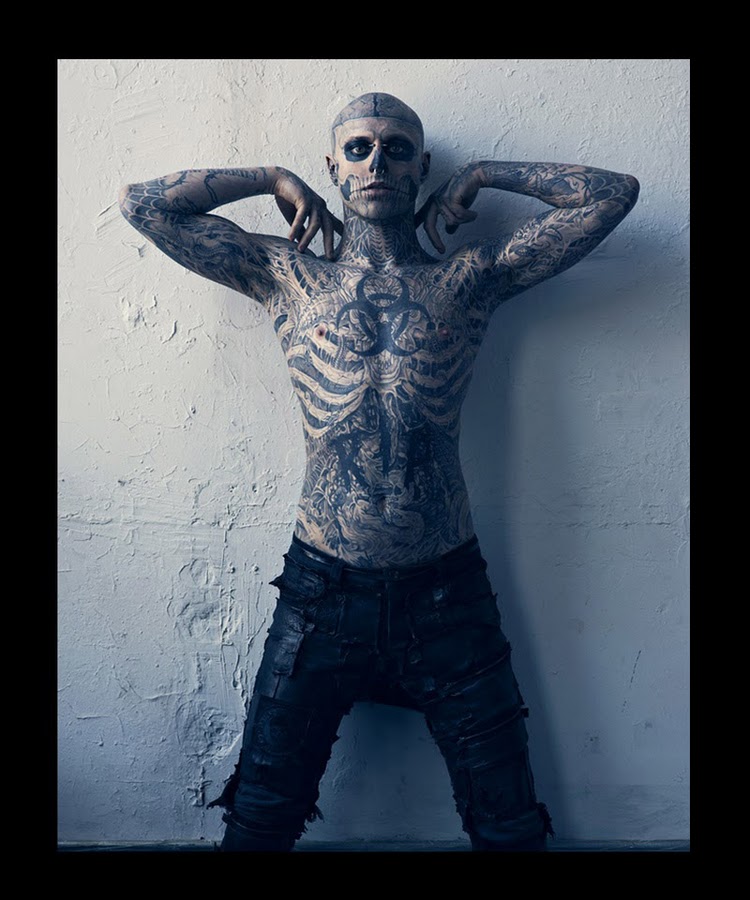 It turns out his name is Rick Genest aka Zombie Man and the tattoos are 