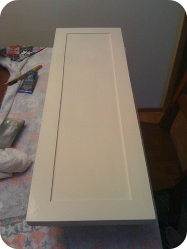 First cabinet door with trim added and painted by Julie @ Build, Sew, Reap