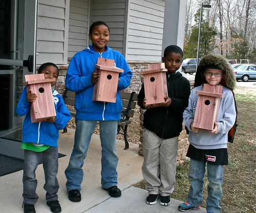 Youth volunteers and their finished bluebird boxes.