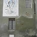 [senza titolo]; 1990. Acrilico su muro, cm 300x200.<br />
Maglione, Via Vittorio Emanuele II.<br />
