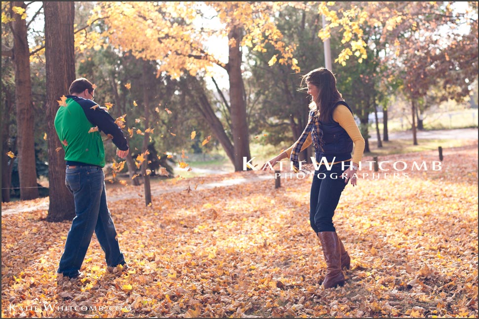 Katie.Whitcomb.Photographers_chrissy.and.jim.playing.in.the.leaves