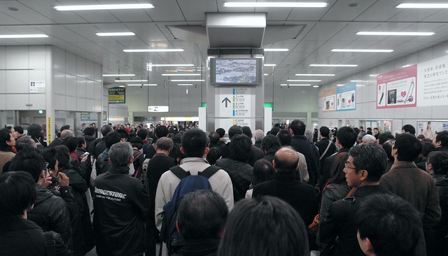 JR Akihabara station : people see TV news about earthquake