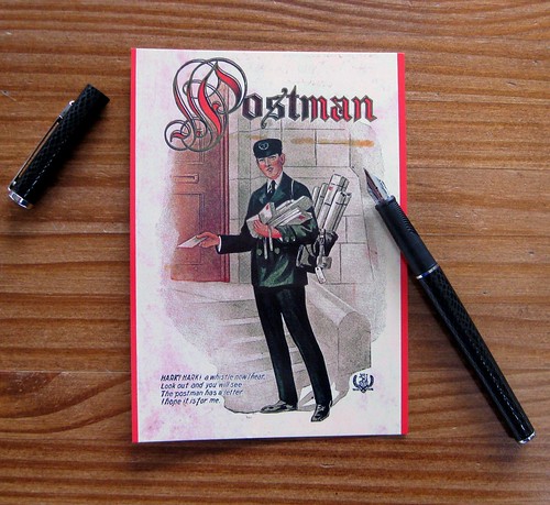 Postman postcard front with pen