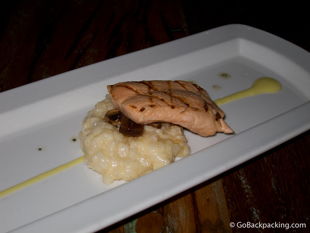 Moment 9: Close-up of salmon and white risotto with truffle oil and avocado sauce (not shown: tomato jelly).