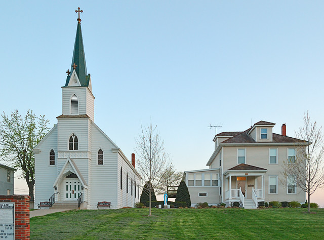 Immaculate Conception Roman Catholic Church, in Augusta, Missouri, USA - exterior at sunset with rectory