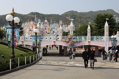 Entrance to It's a Small World, the Disneyland Railroad crosses the bridge in the foreground