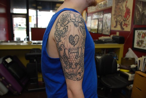 half sleeve and chest tattoo