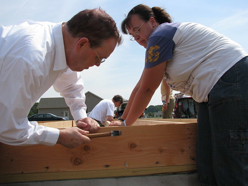 Agriculture Under Secretary for Rural Development Dallas Tonsager helps prospective homeowner Suzanne Passwaters construct floor joists at a USDA Self Help Housing site on the DelMarVa Peninsula.   