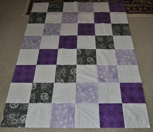 gray and purple quilt top