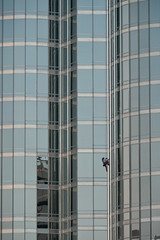 Alain Robert starting his way up the world's tallest building. Took him just over six hours to conquer.