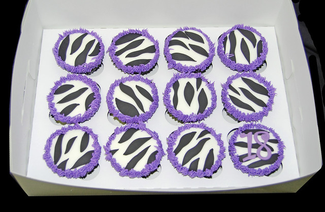 black and white zebra cupcakes with purple fringe for 18th birthday