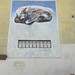 Composizione; 1985. Affresco e pietra, cm 300x250.<br />
Maglione, Via Cavour.<br />
