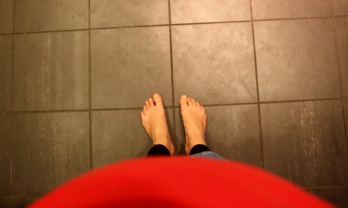 Barefoot and pregnant in the kitchen