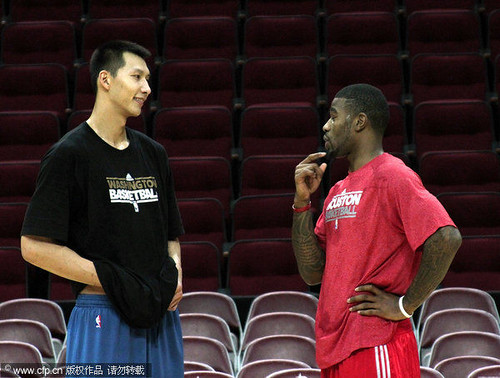 December 27th, 2010 - Yao Ming talks with former teammate Terrence Williams before the Rockets-Wizards game