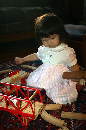Playing with a train set at the Button's house