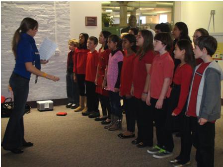 A choral group of fifth graders from an advanced program at Bailey’s Elementary School in Falls Church, VA sing Christmas carols to Forest Service employees of the Yates Building for the Chief’s holiday party on Monday, Dec. 6, 2010. Bailey’s Elementary School is one of six partnership schools collaborating with Sustainable Operations to promote a sustainability ethic and enhance science curriculum for students. Photo by Maritza Huerta.