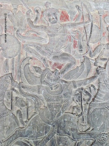Vishnu riding garuda fights demons