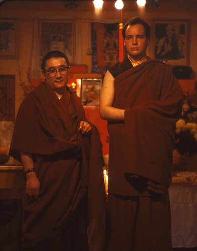 His Holiness Trinley Sakyapa (1934 - 1997), a realized Tibetan Lama, and Christopher Wilkinson, a Tibetan translator and scholar, Tibetan Buddhist monks, with a candle between them, shrine room, Seattle, Washington, USA by Wonderlane
