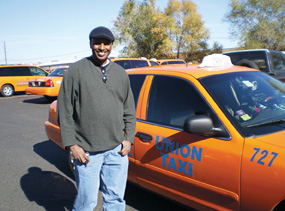 Union Taxi driver Abdi Buni, an organizer with CWA Local 7777, is helping organize SuperShuttle drivers at Denver International Airport. He and his co-workers organized with CWA in 2006 and formed Union Taxi.