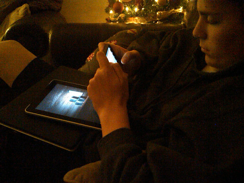 Brian on phone ipad and laptop