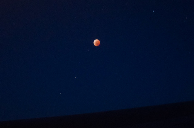 Total Lunar Eclipse, handheld photos taken from 36000ft above siberia