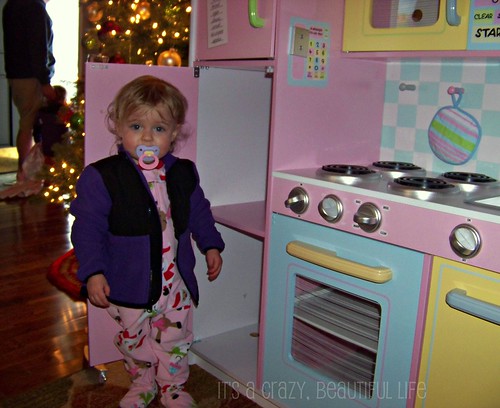 Checking out her kitchen and wearing her new jacket