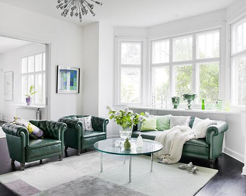 family-room-with-green-chairs-and-sofa