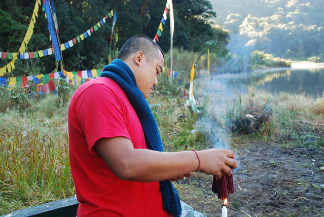 lighting incense at Khecheopalri Lake