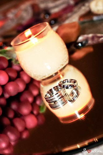 Wedding Rings and Mirrored Candle