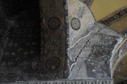 Corner showing intact mosaic next to plastered mosaic and painted Islamic decoration