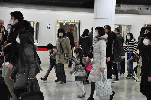 Japan Earthquake: kids leaving Tokyo from Haneda airport