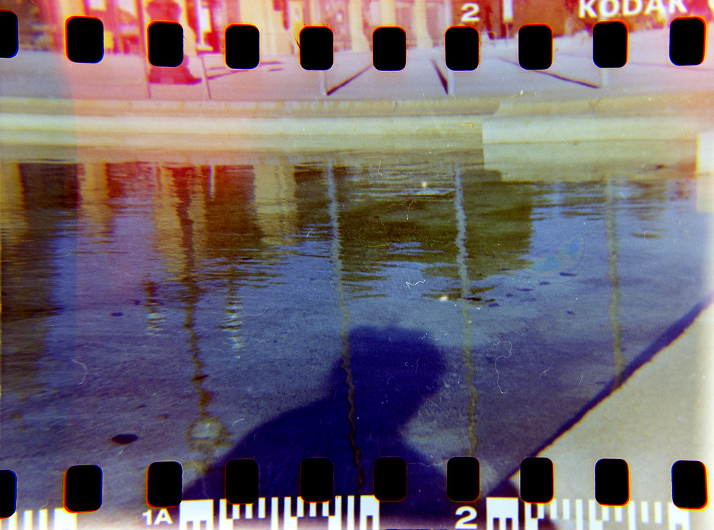 My shadow on a pond.