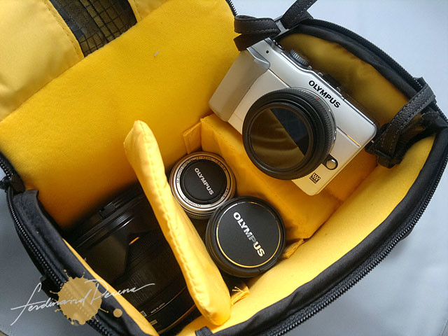 The main compartment can fit my Olympus PEN, 3 more lenses and filters