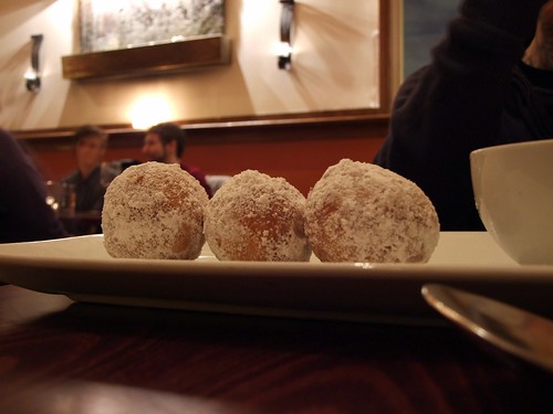 Chocolate filled beignets covered with powdered sugar.
