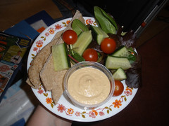 Pitta bread fingers with hummus and salad