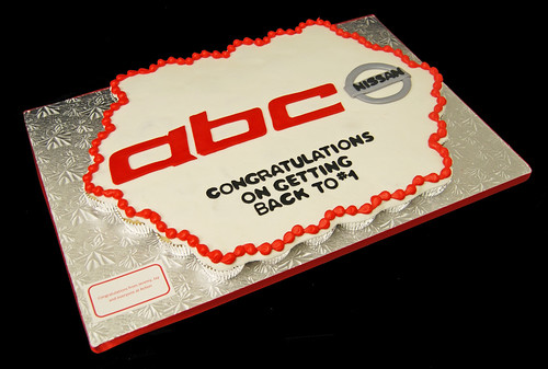 business gift from advertising agency to local car dealership - logo cupcake cake