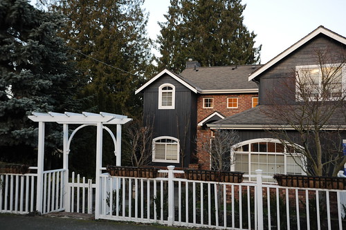 White arbor gate, fence, gray house, North Matthews Beach, Sand Point Way Uplands, Seattle, Washington, USA by Wonderlane