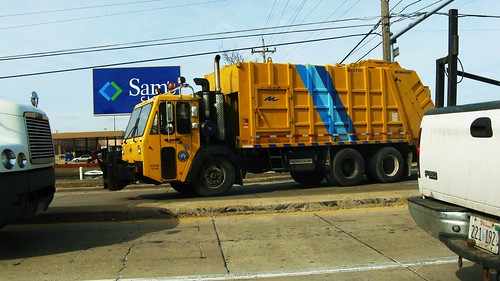 A large yellow CCC garbage truck. Des Plaines Illinois USA. Monday, March 14th, 2011. by Eddie from Chicago