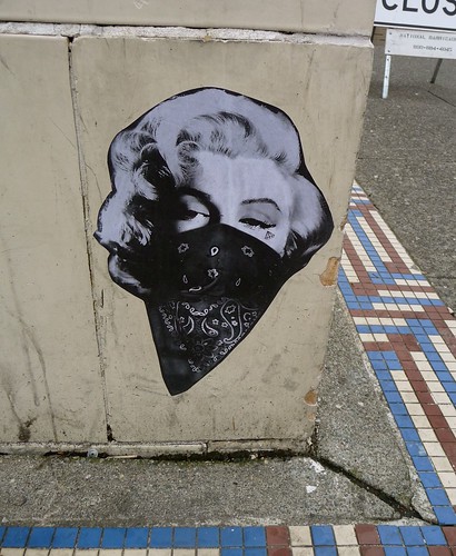 pasted graffiti -- Marilyn Monroe wearing a bandana over her face