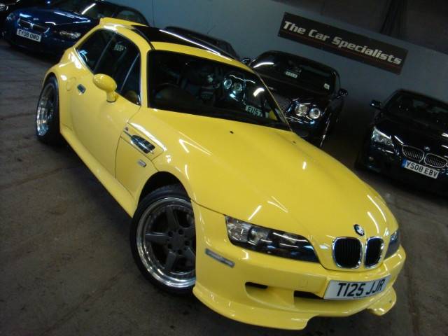 Dakar Yellow M Coupe with AC Schnitzer Type II wheels, AC Schnitzer Type II spoiler, AC Shnitzer splitters, AC Schnitzer pedals, AC Shnitzer ebrake handle, and Apline head unit