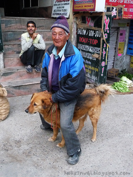 Tibetan Man Riding Dog