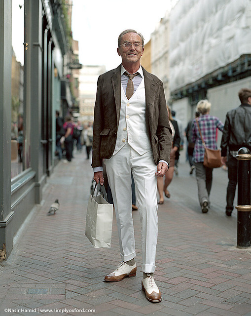 A smartly dressed man on a London street
