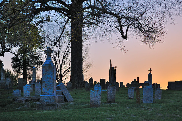 Saint Vincent de Paul Roman Catholic Church, in Dutzow, Missouri, USA - cemetery at sunset