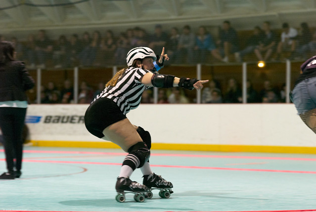 pointing at the lead jammer, not the lead jammer herself