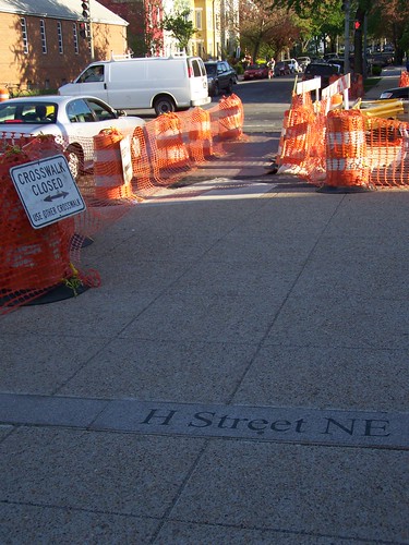 H Street NE marker placed in the sidewalk